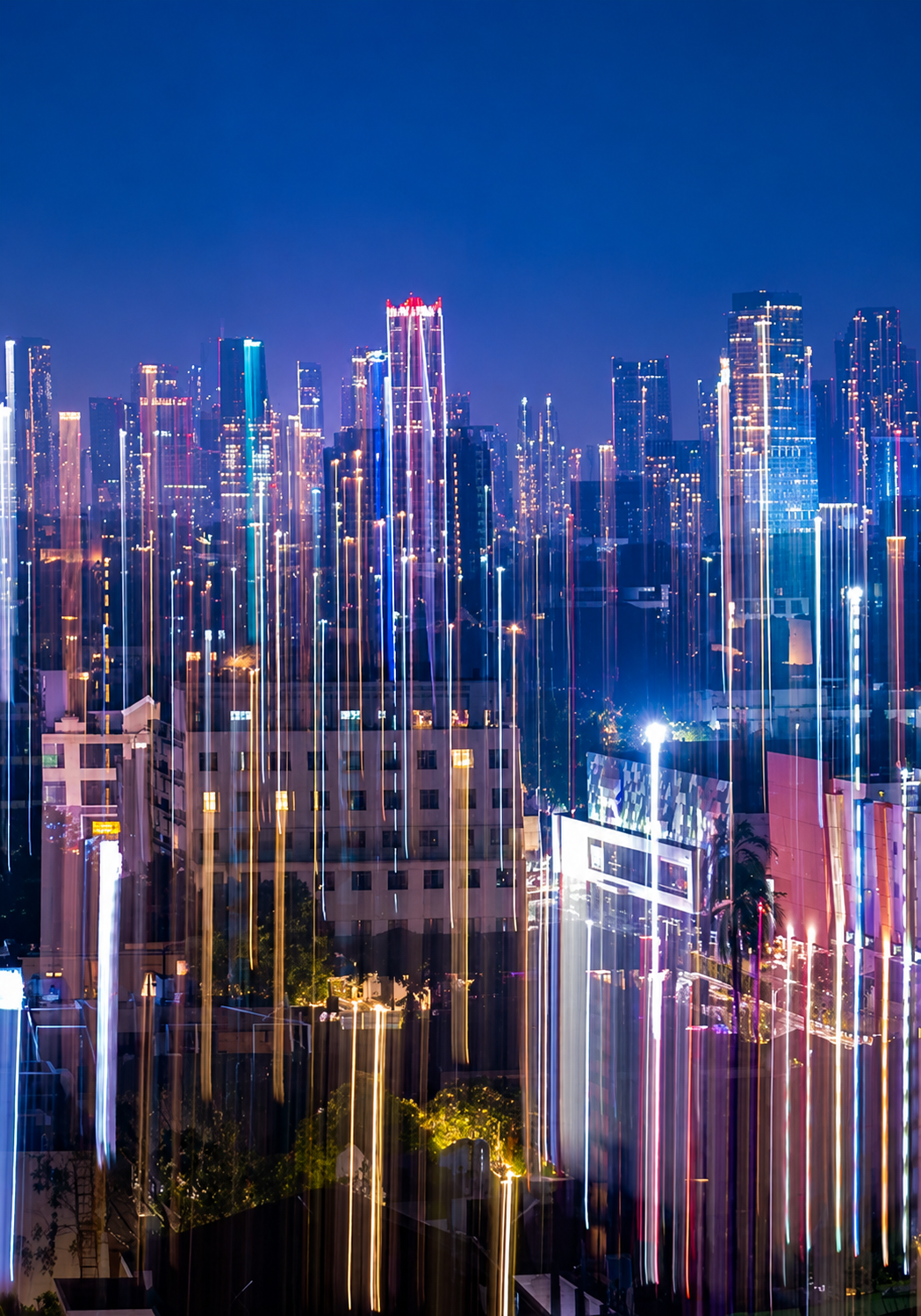 City skyline at night with light trails